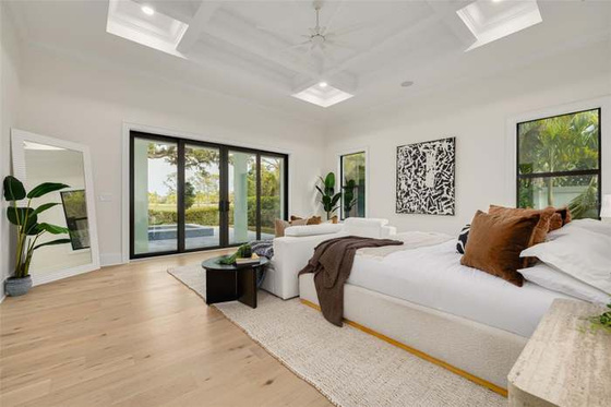 Airy primary bedroom with organic modern styling