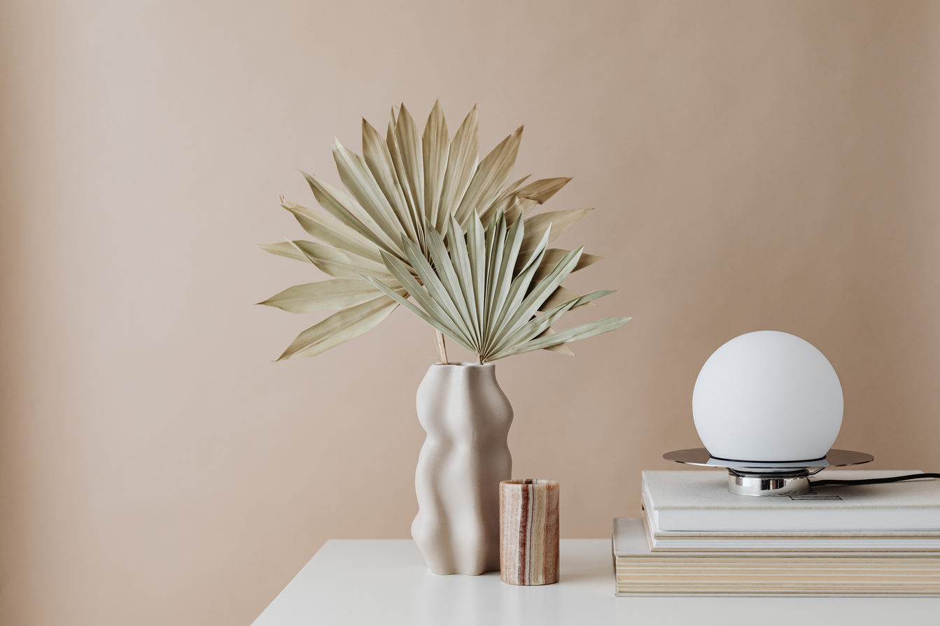 Curated books, lighting and botanical styling detail