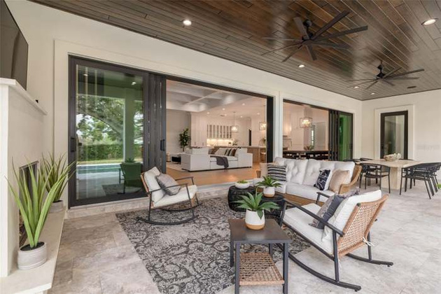 Covered outdoor living space staged for entertaining